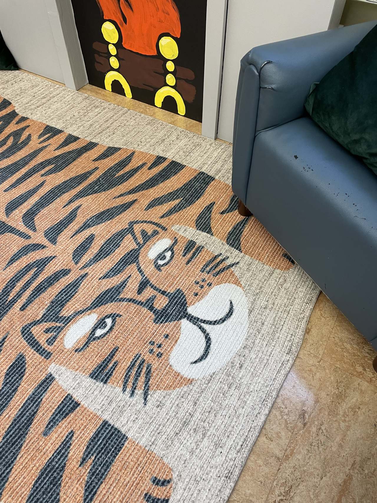 The tiger rug in front of the Goodnight Moon fireplace