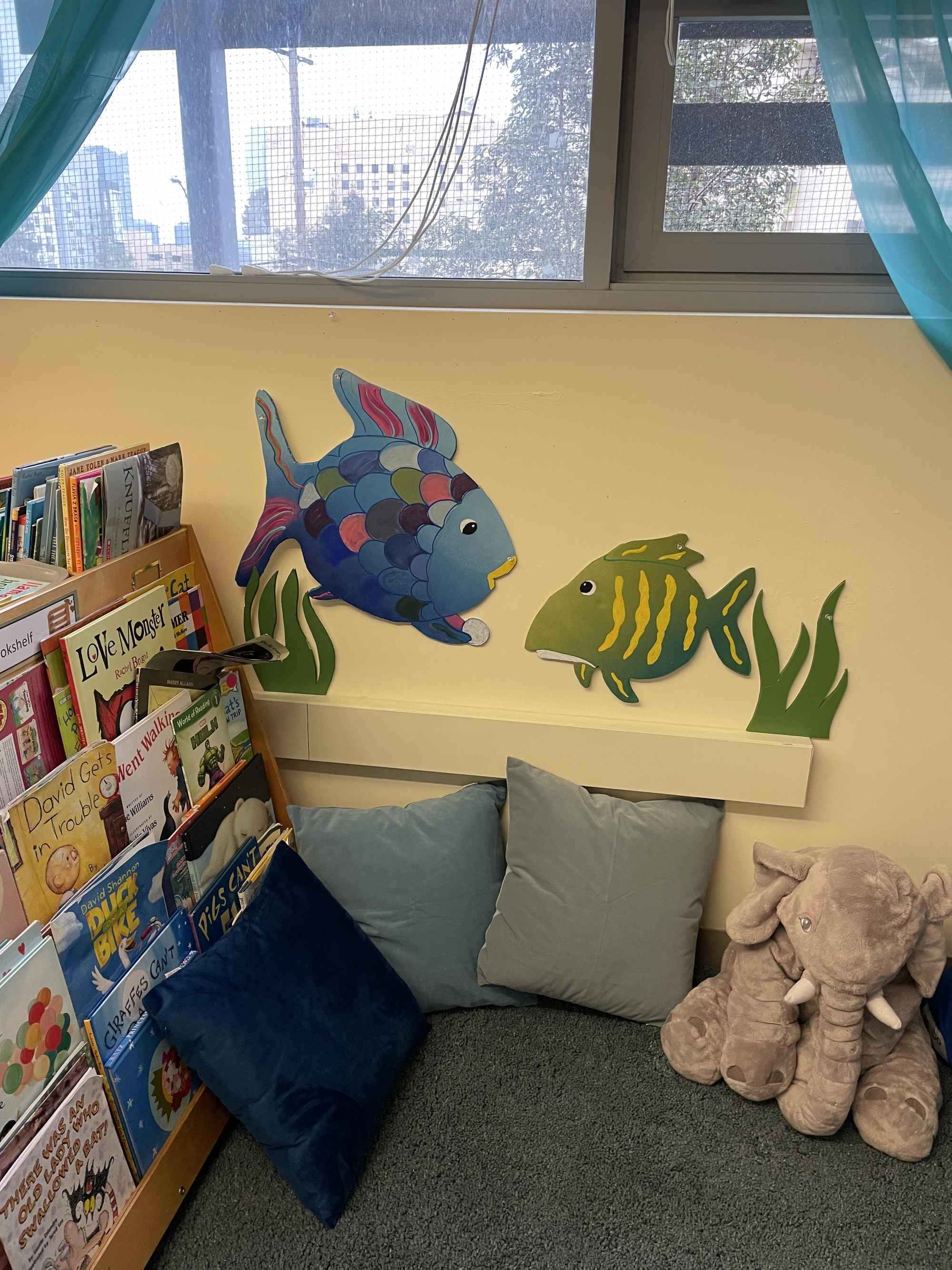 A reading nook in the Coral Reef room